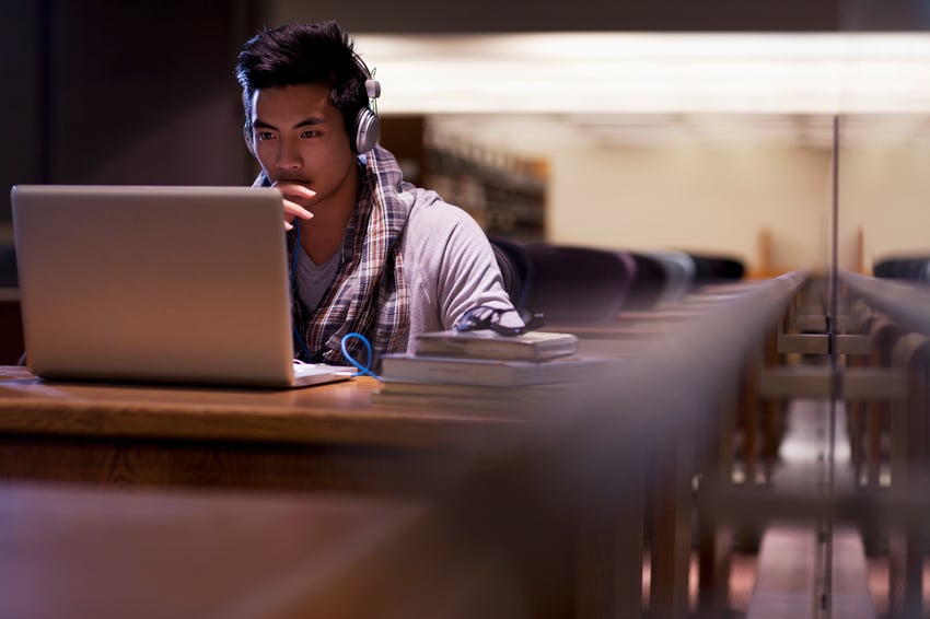 student in library